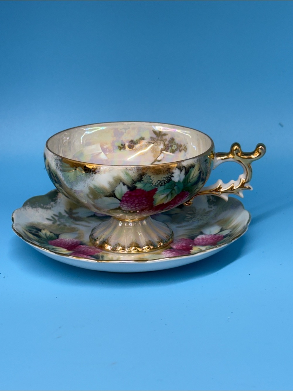 gorgeous mid-century vintage footed teacup and matching saucer set.